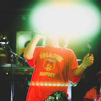 a man is singing into a microphone