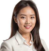 an asian business woman posing for a photo