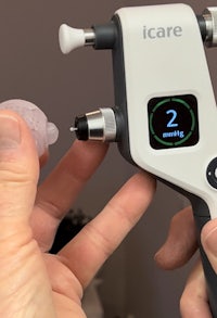 a person is holding a device that has a button on it