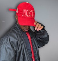 a man wearing a red hat with the word det on it