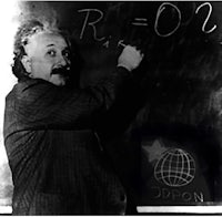 a blackboard with albert einstein writing on it