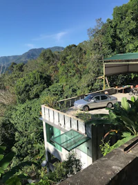 a house with a view of the mountains and trees