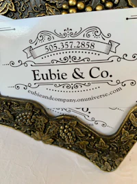 a business card with the word eubie & co on it