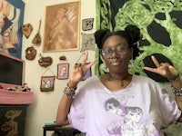 a woman in a purple t - shirt is posing for a photo