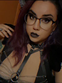 a woman wearing glasses and a cat costume