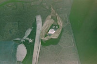 a person's feet on a tile floor
