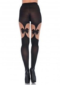 the back view of a woman wearing black stockings with bows