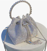 a silver bucket bag with a chain on top