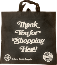 a black shopping bag with the words thank you for shopping here