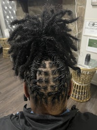 a man with dreadlocks in his hair
