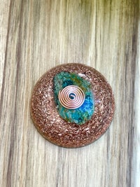 a circular piece of glass with a spiral design on it