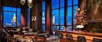 a bar with a view of the city at night