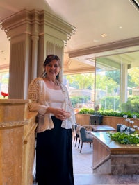 a woman standing in a lobby