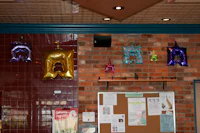 a room with balloons hanging from the ceiling