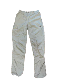 a pair of white ski pants on a black background