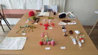 a table with various crocheted items on it