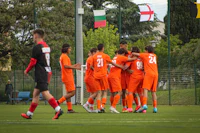 a group of soccer players on a field