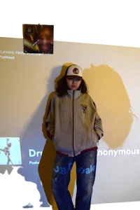 a person standing in front of a projection screen