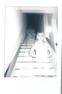 a photo of a woman standing on the stairs