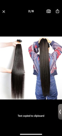 a woman's hair is shown on a phone screen