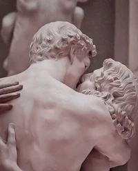a statue of a man and woman hugging each other