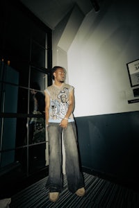 a man standing in front of a mirror