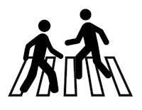 two people crossing a road in black and white
