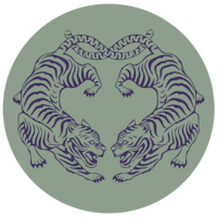 a purple and green circle with two tigers on it