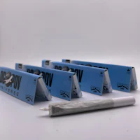 a pack of blue and white boxes with a cigarette in the middle