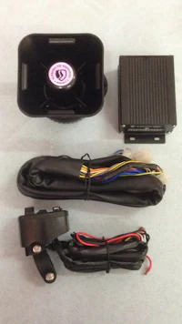 a car alarm system with wires and a speaker