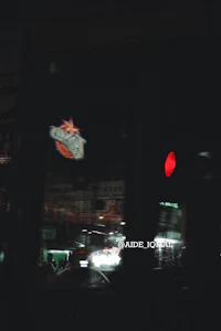 a blurry image of a bus at night