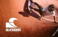 a man is riding a skateboard in a skate park