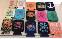 a group of can koozies with different designs on them
