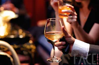 a group of people drinking wine at a party