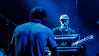 a group of people playing music on stage