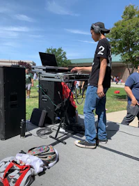 a man playing a dj on a stage