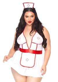 a woman in a white nurse costume posing