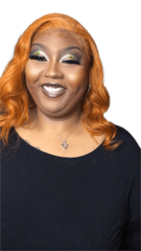 a woman with orange hair and green eye makeup