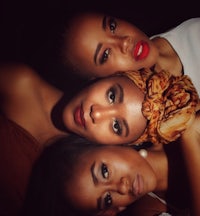 three african women posing for a photo