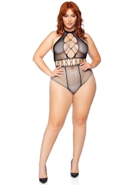 a plus size woman in a black fishnet bodysuit