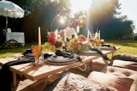 a table is set up in a grassy area