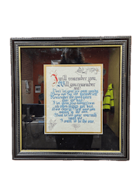 a framed piece of paper with a poem on it