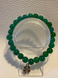 a green jade bead bracelet with a silver clasp