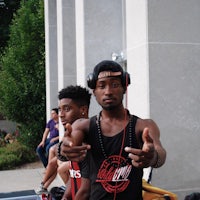 a man wearing a black tank top