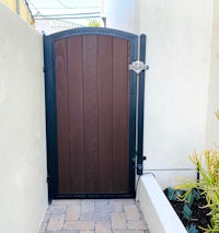 a wooden gate with a brown door
