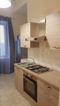 a small kitchen with a stove and oven