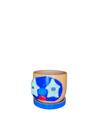 a blue flower pot with a blue face on it