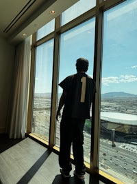 a person standing in front of a large window