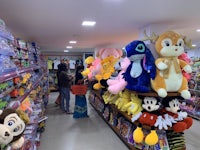 a toy store with stuffed animals on the shelves