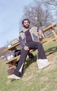 a man sitting on a picnic table